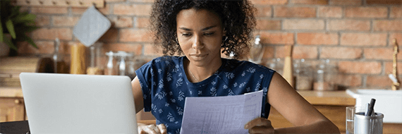 Image: woman looking at paper